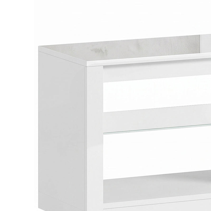 Close-up of the white TV stand's glossy top and corner edge