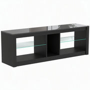 Black LED TV stand with glass shelves and a centre compartment on a plain background