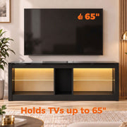 Black TV stand under a wall-mounted 65 inch TV with the text holds TVs up to 65 inches
