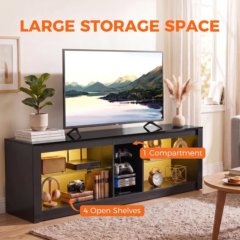 Black TV stand with callouts for four open shelves and one compartment, styled with a TV and ornaments