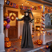 Animated witch decoration staged on a porch decorated for a Halloween party