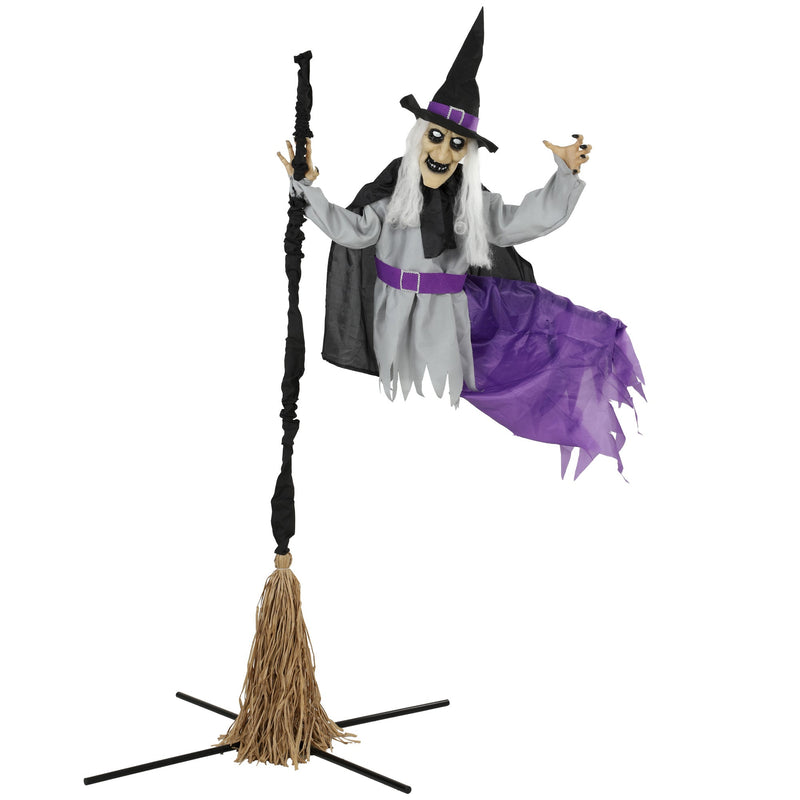 Homcom flying Halloween witch riding a raffia broomstick, studio shot