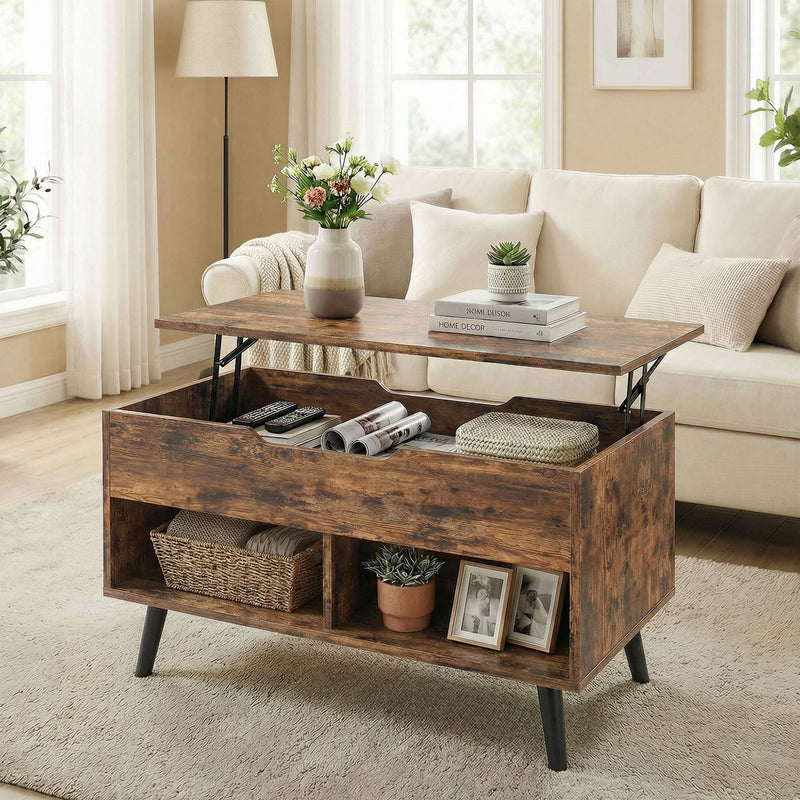 Rustic brown lift top coffee table styled in a living room with a vase, books and cushions on the sofa behind it