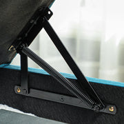 Close-up of the storage lid's gas-strut hinge mechanism