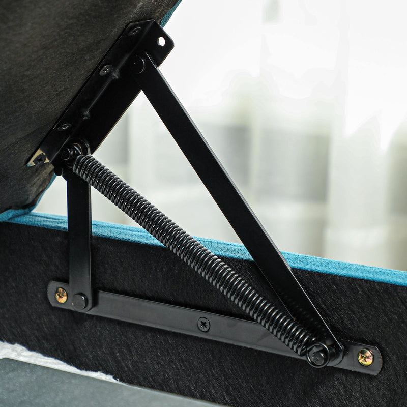 Close-up of the storage lid's gas-strut hinge mechanism