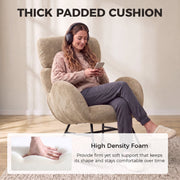 Woman relaxing in the rocking chair with headphones, showing the thick padded seat cushion