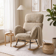 Rocking chair styled in a living room corner with a throw blanket and storage basket