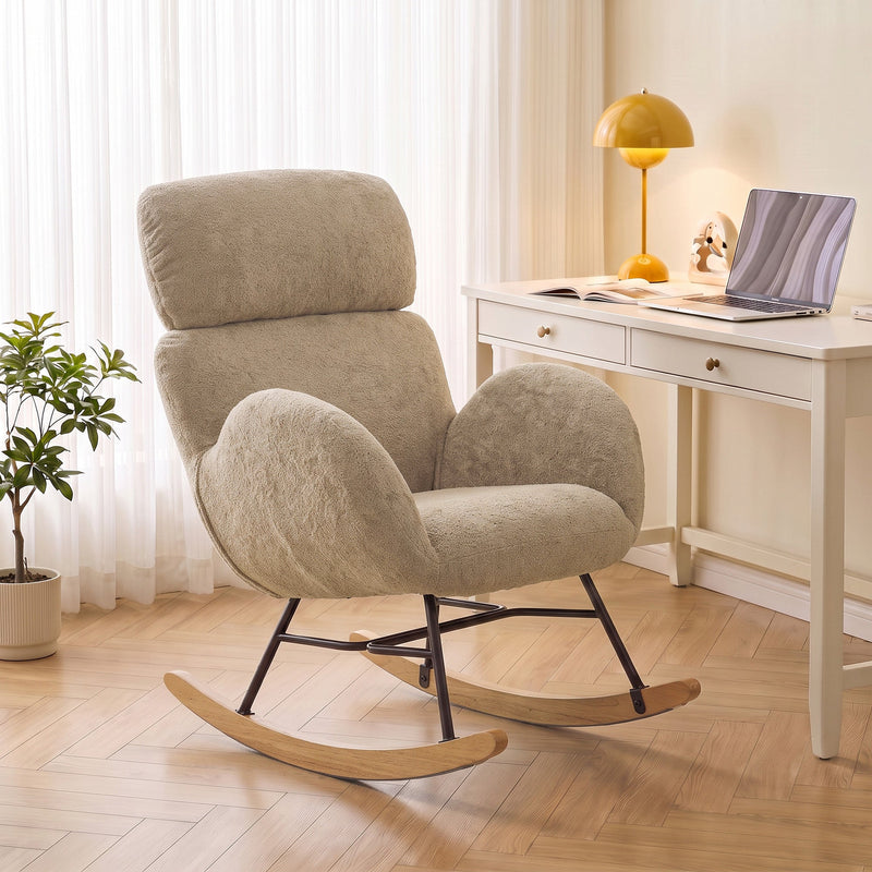 Rocking chair placed beside a desk and lamp in a home office corner