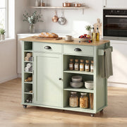 Light green kitchen island with side towel compartments, bowls and storage jars on the shelves