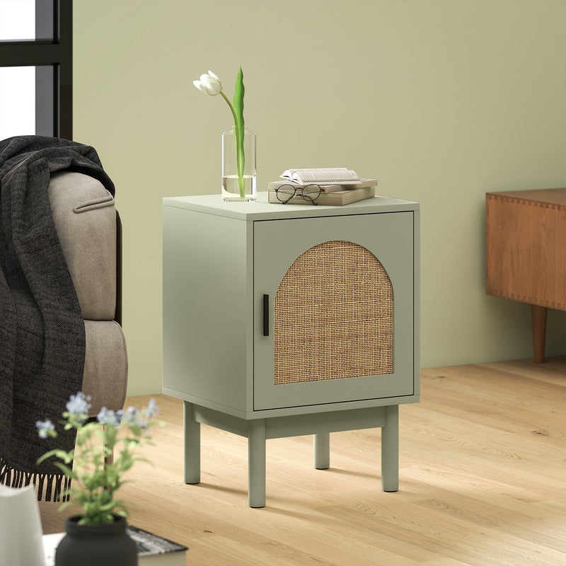 Bedside table used as a living room side table with a flower vase and open book on top