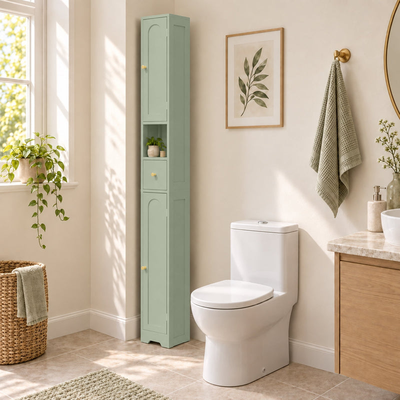 Light green cabinet beside a toilet with a towel basket and wall art