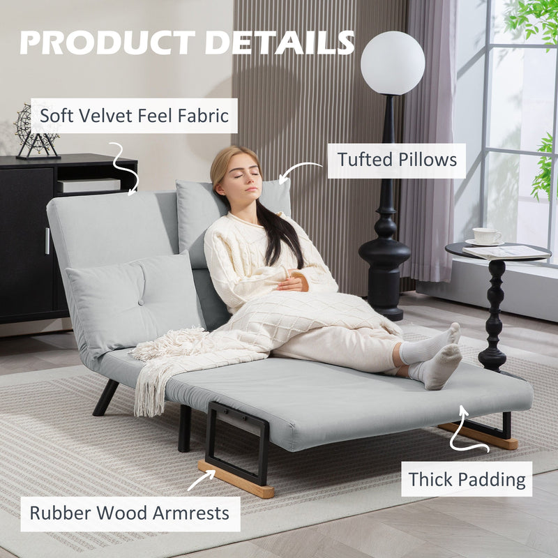 Labelled product details shot showing velvet fabric, tufted pillows and rubber wood armrests