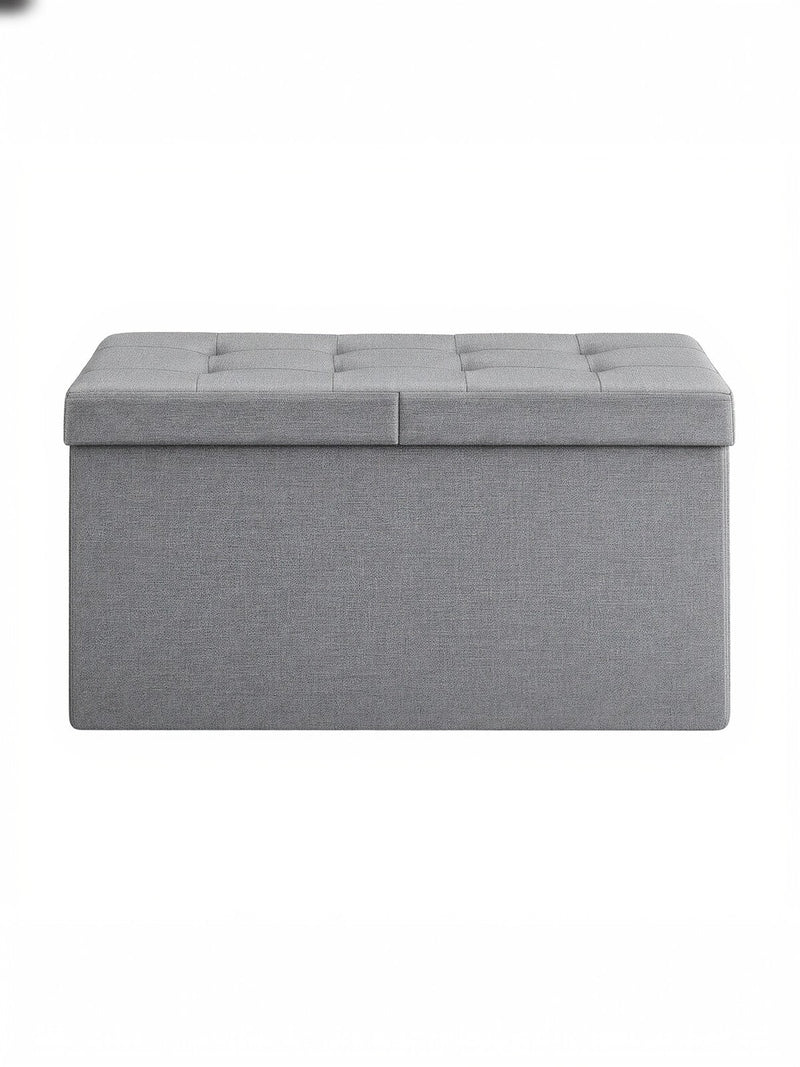 Light grey tufted fabric storage ottoman bench, studio shot