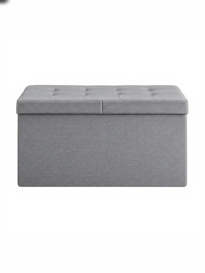 Light grey tufted fabric storage ottoman bench, studio shot