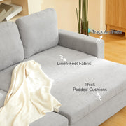 Close-up of the track armrest and padded cushions in light grey linen-look fabric