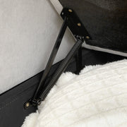 Close-up of the metal spring hinge mechanism inside the pull-out bed frame