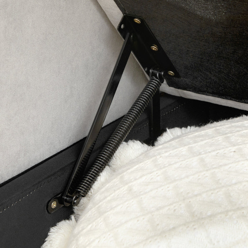 Close-up of the metal spring hinge mechanism inside the pull-out bed frame