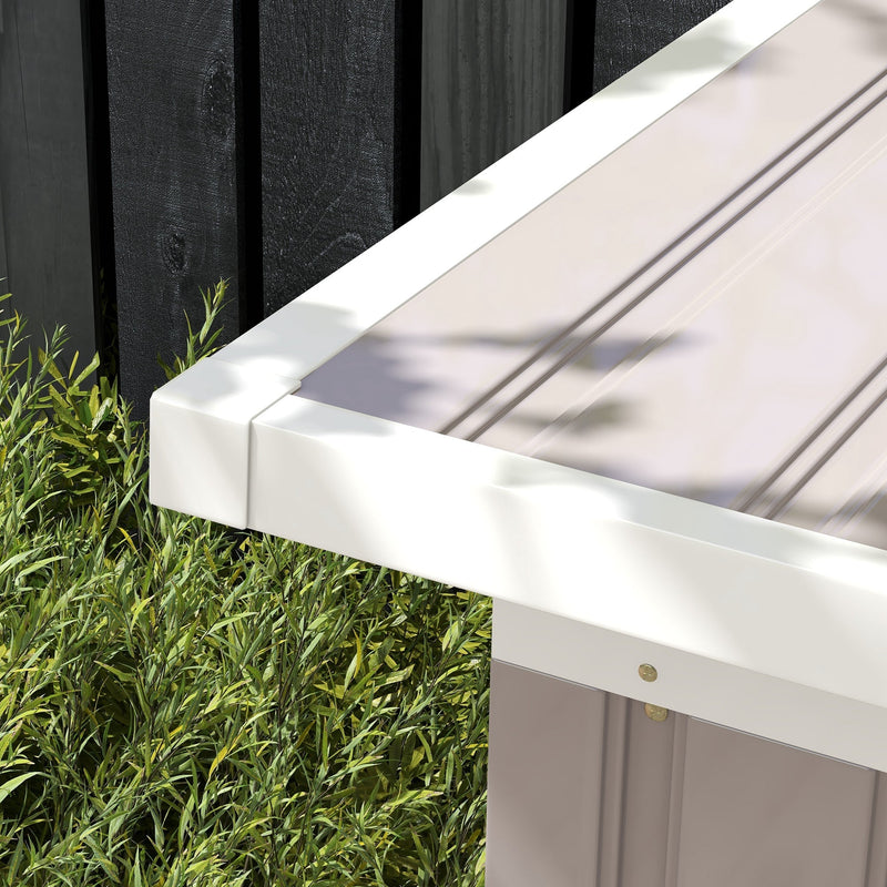Close-up of the roof edge and white eave trim on the light grey shed
