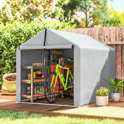 Light grey shed tent in a garden with a bicycle and shelves of tools inside