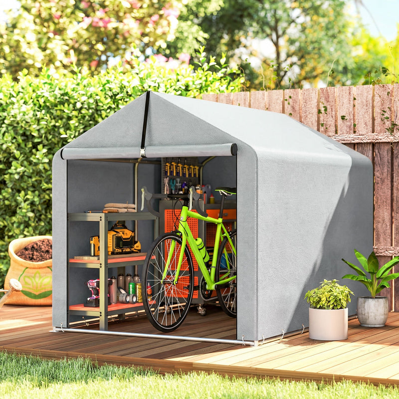 Light grey shed tent in a garden with a bicycle and shelves of tools inside