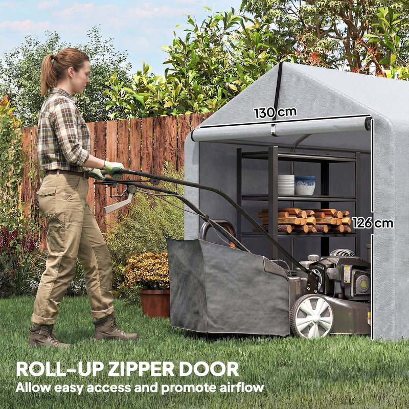Woman pushing a lawn mower into the shed tent, with door size marked 130cm wide by 126cm high