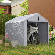 Light grey shed tent on a lawn with a motorbike parked inside