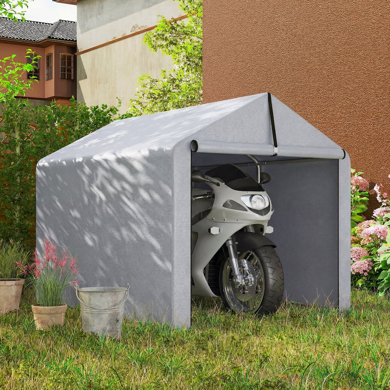 Light grey shed tent on a lawn with a motorbike parked inside
