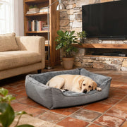 Removable cover partially unzipped on the light grey dog bed