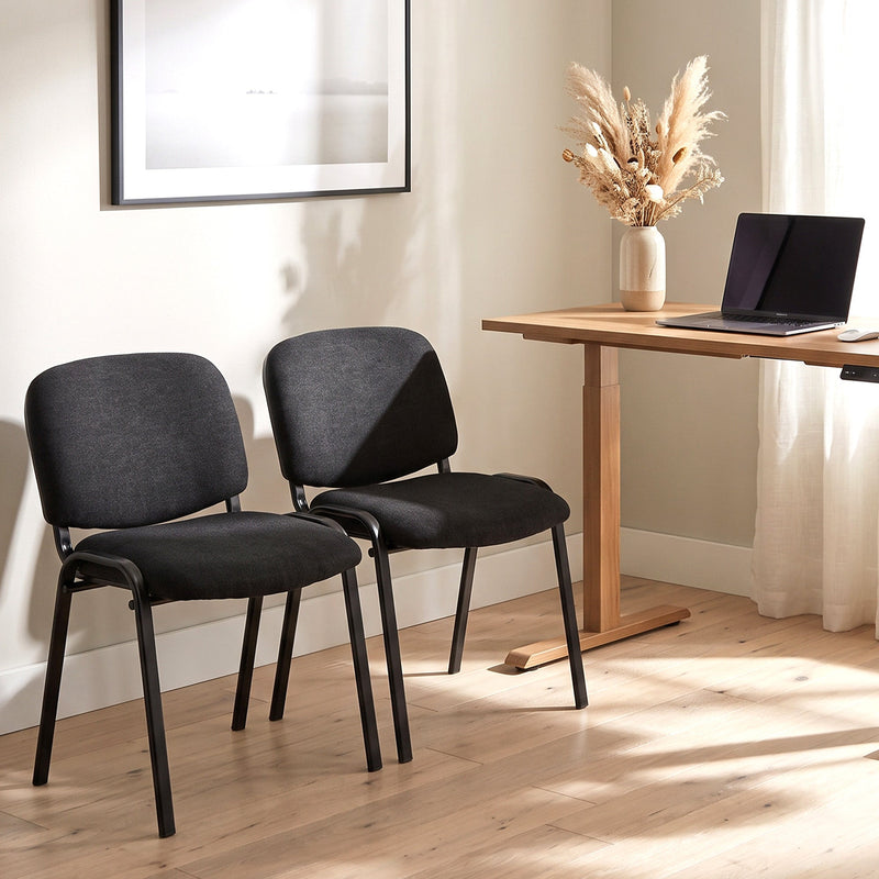 Homcom reception chairs placed beside a desk in a bright home office setting