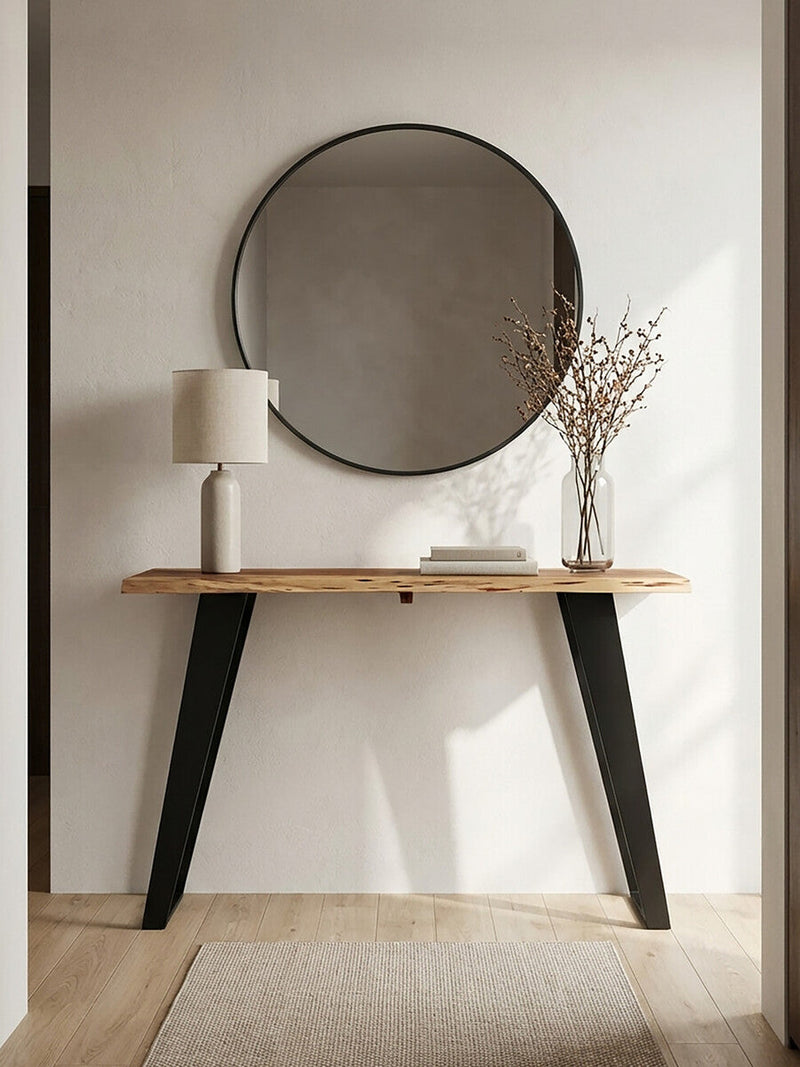 Acacia console table in a living room setting placed behind a sofa with a lamp on top