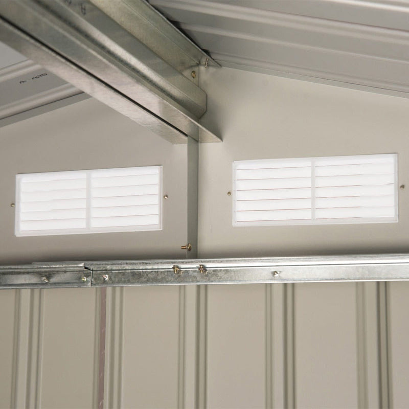 Interior of the steel grey shed showing the roof beam and two wall vents