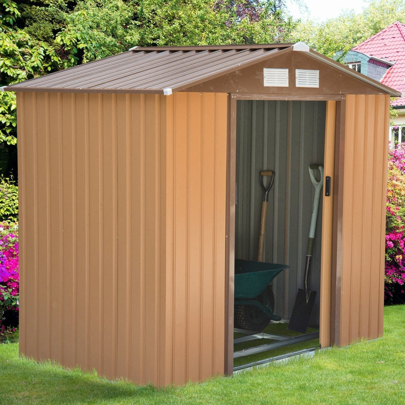 Tan yellow 7x4ft metal shed in a garden with plants and gravel