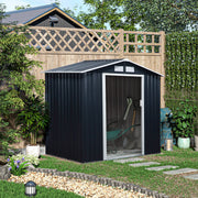 Dark grey shed set against a trellis fence in a planted garden
