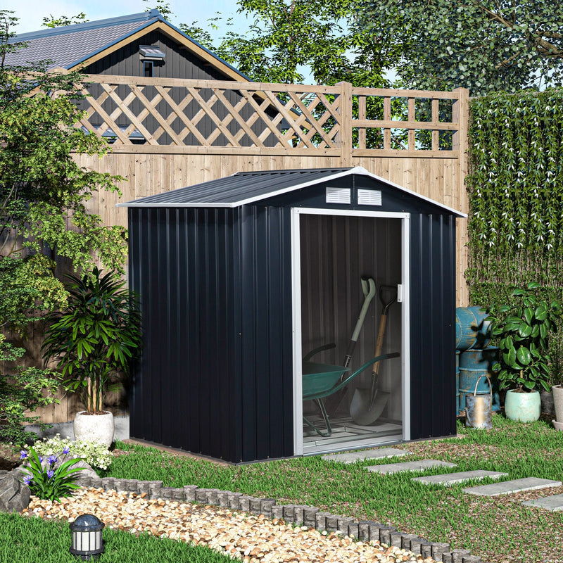 Dark grey shed set against a trellis fence in a planted garden