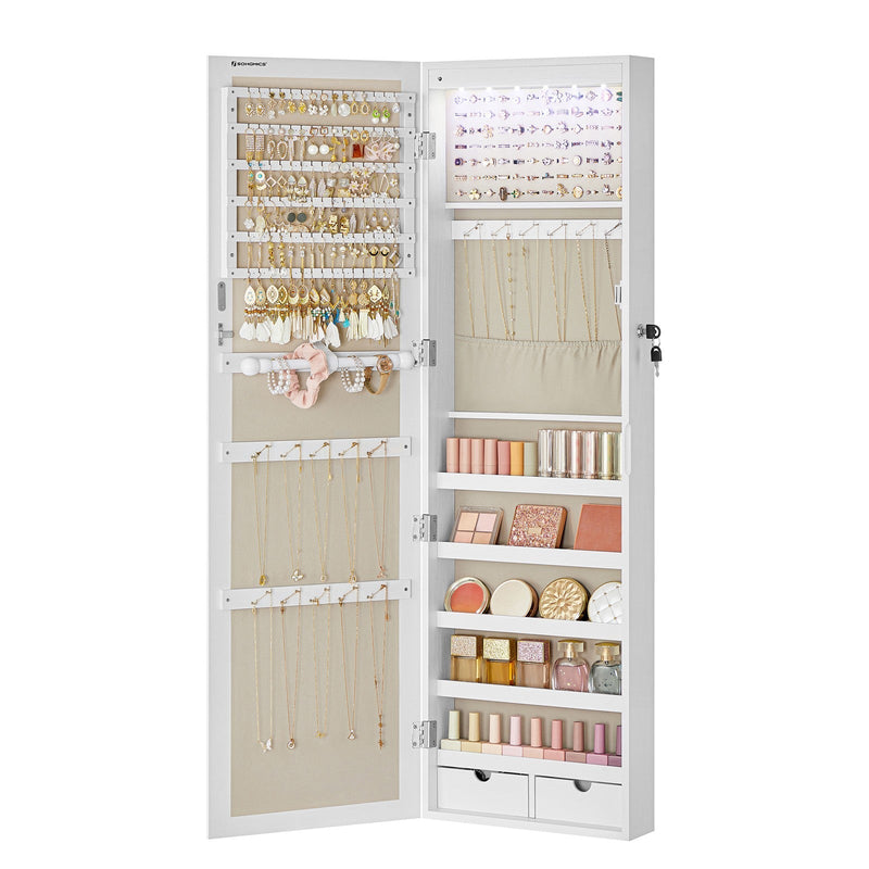 Open cabinet interior fully stocked with earrings, rings, necklaces and cosmetics