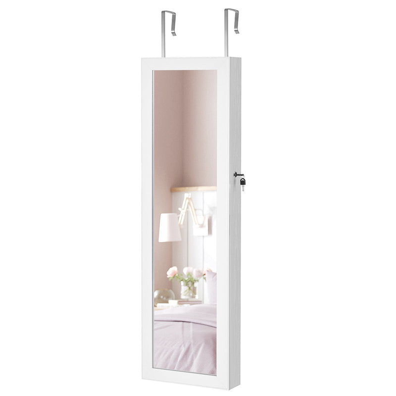 Closed white cabinet hanging on over-door hooks, angled view showing the lock