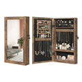 Rustic brown jewellery cabinet shown closed with its mirror door and again open, filled with jewellery