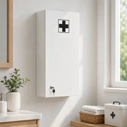 Medicine cabinet on a bathroom wall above a wicker basket and first aid box