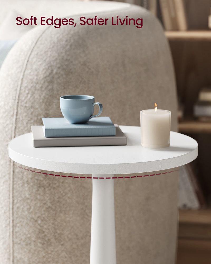 Rounded Cloud White tabletop edge holding a blue cup, grey books and a lit candle