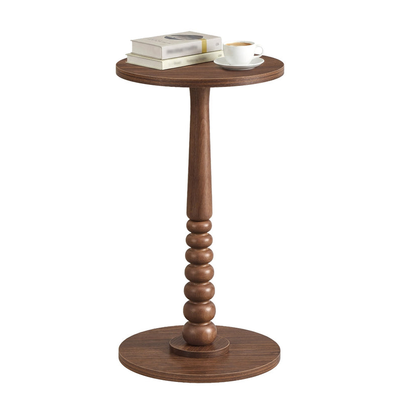 Chestnut Walnut MARIEL round side table on a plain background topped with books and a coffee cup