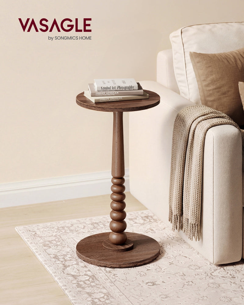 Chestnut Walnut side table on a patterned rug beside a cream sofa with a folded throw