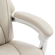 Close-up of the padded armrest and white arm support on the cream white chair