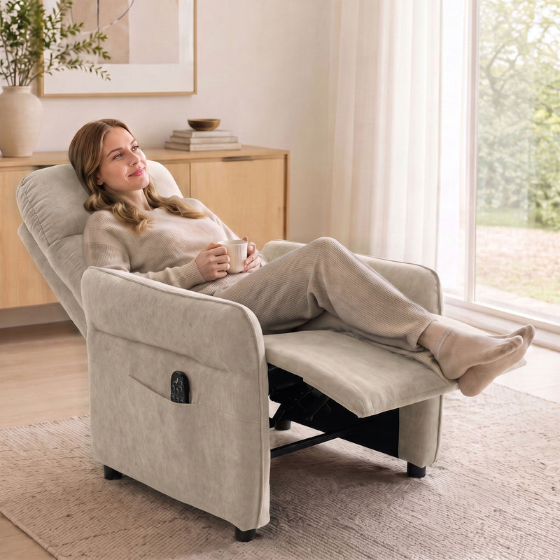 Woman reclining with feet up in the beige recliner armchair near a window