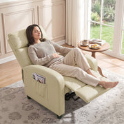 Woman reclining in the cream white recliner armchair beside a window with a coffee table
