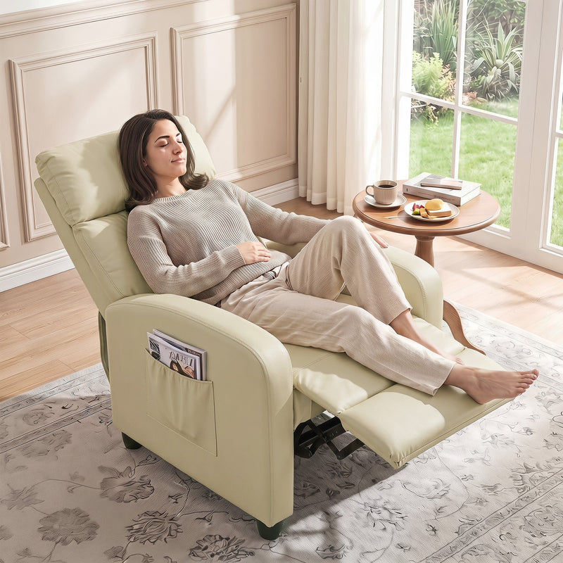 Woman reclining in the cream white recliner armchair beside a window with a coffee table