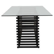 End view of the dining table showing the vertical slats of the black steel base