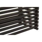 Macro detail of the slat spacing along the matt black dining table base