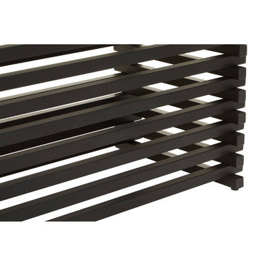 Macro detail of the slat spacing along the matt black dining table base