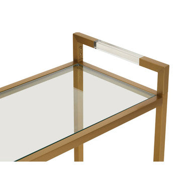 Close-up of the clear glass top edge meeting the gold frame rail
