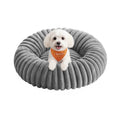 Feandrea medium dog and cat bed in dove grey with a small dog sitting inside on a white background